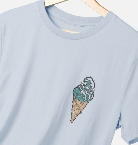 Sky blue t-shirt on a white background, the t-shirt has an ice cream in the shape of waves as a logo print.