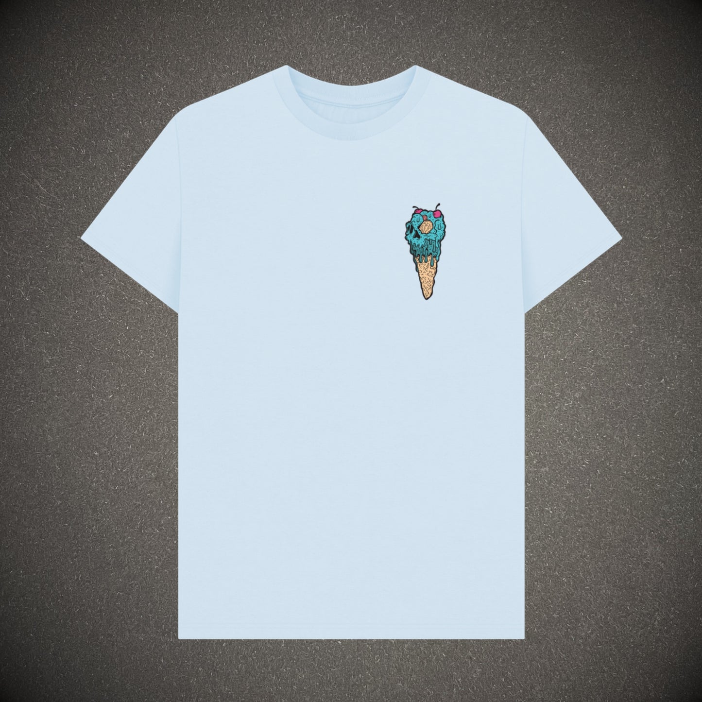 Stone blue t-shirt on a dark grey background, the t-shirt has an ice cream skull logo print.