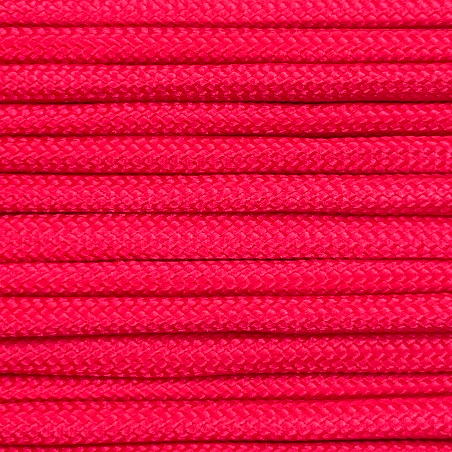 Close-up image of red 550 paracord, showcasing the vibrant colour and texture of the material.