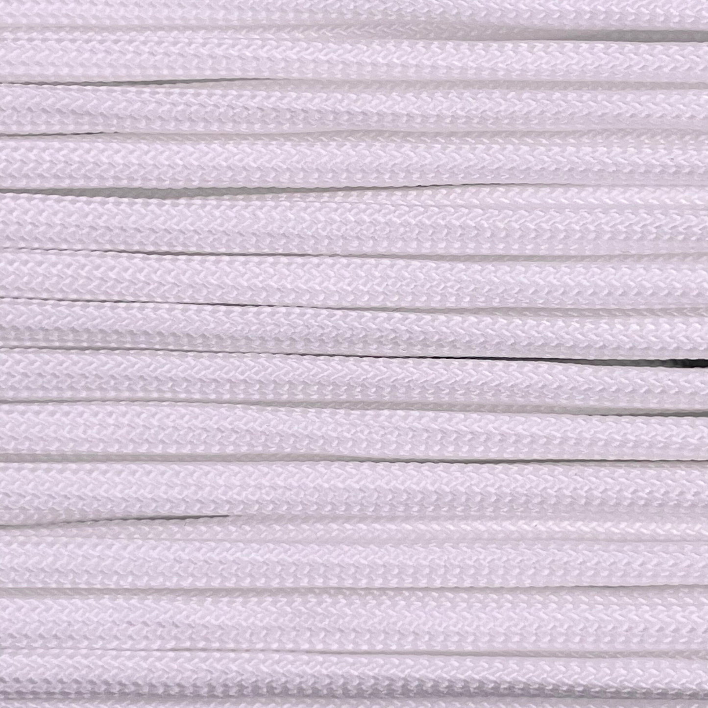 Close-up image of white 550 paracord, showcasing the vibrant colour and texture of the material.