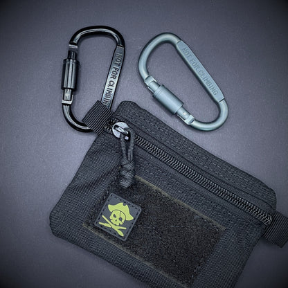 Two carabiners marked 'NOT FOR CLIMBING' clipped to a black pouch.