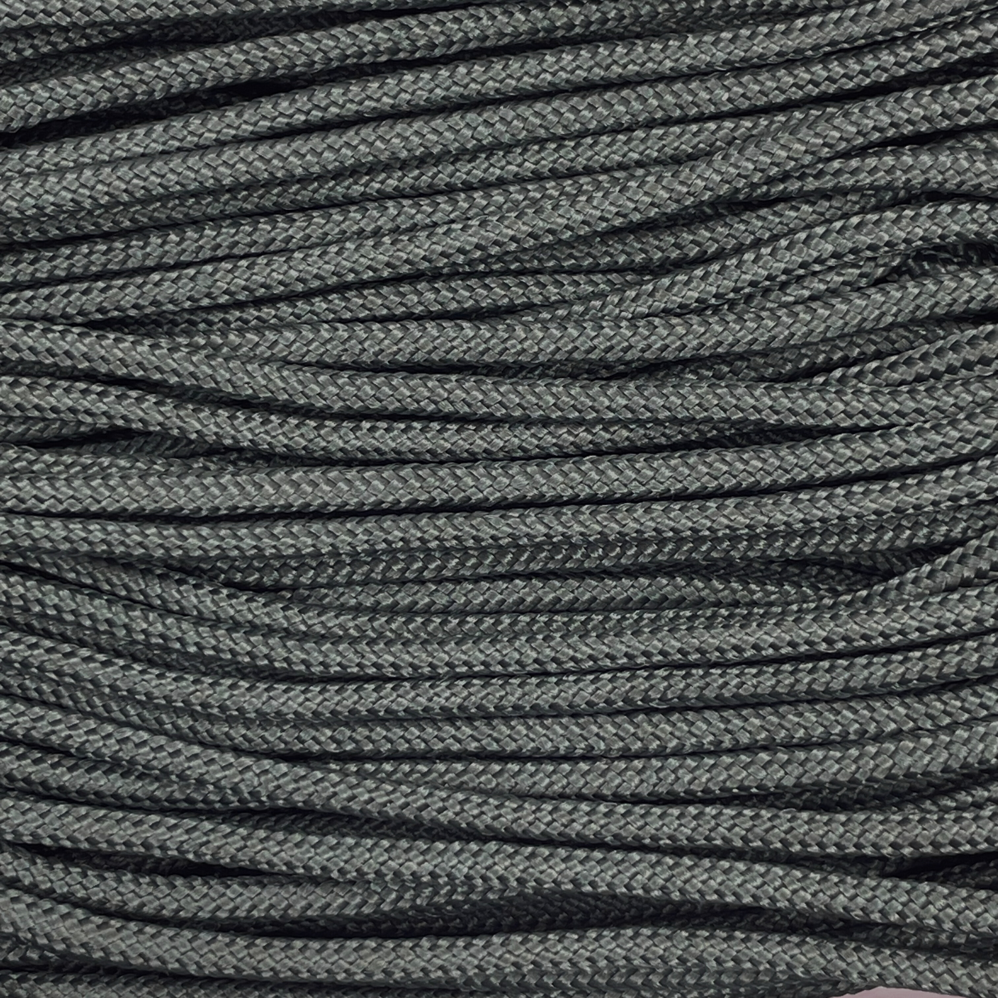 Close-up image of Black 275 Paracord, showcasing the vibrant colour and texture of the material.