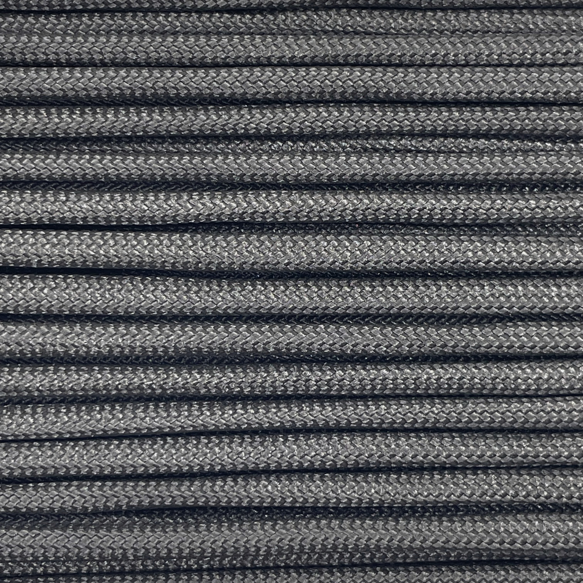 Close-up image of black 550 paracord, showcasing the vibrant colour and texture of the material.