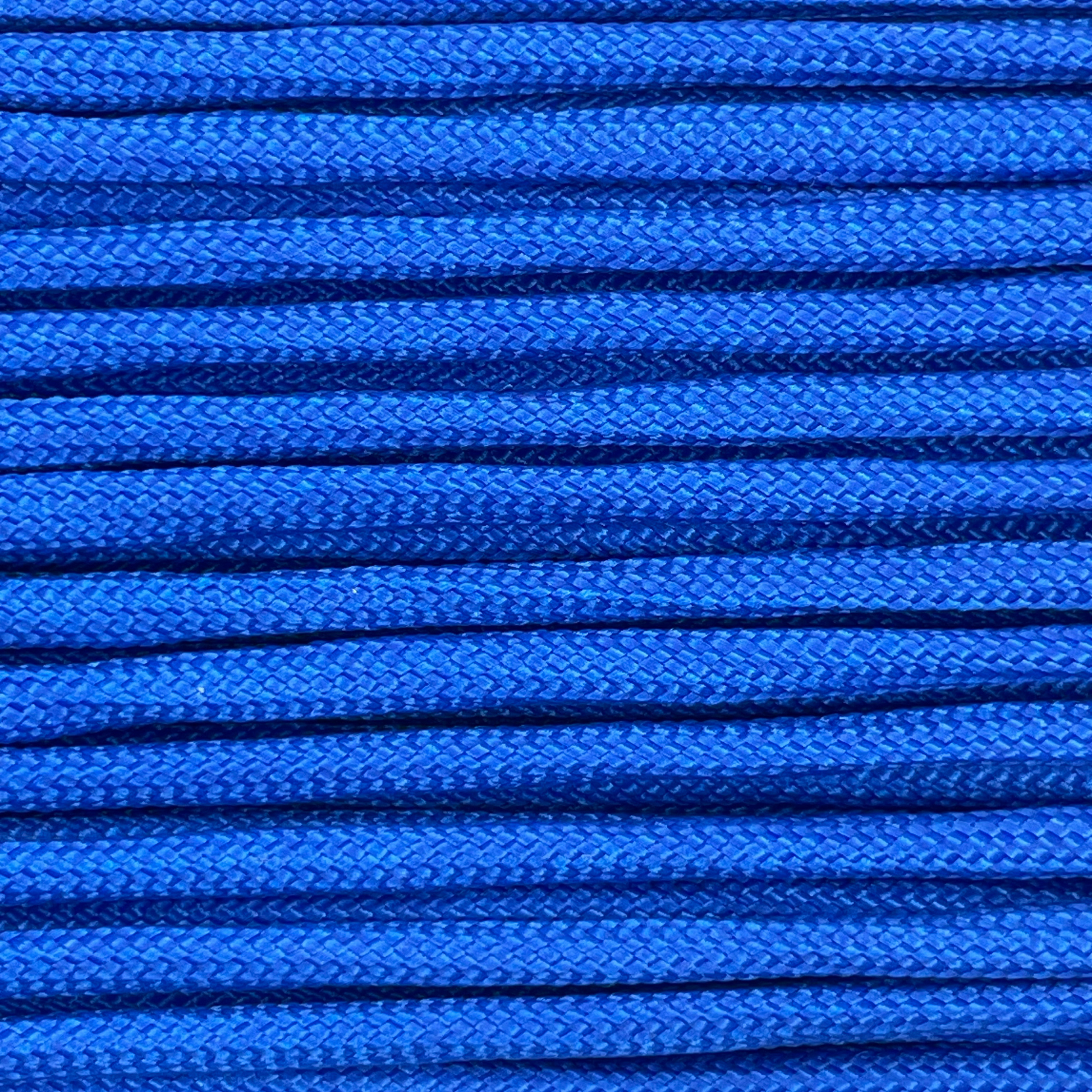 Close-up image of blue 550 paracord, showcasing the vibrant colour and texture of the material.