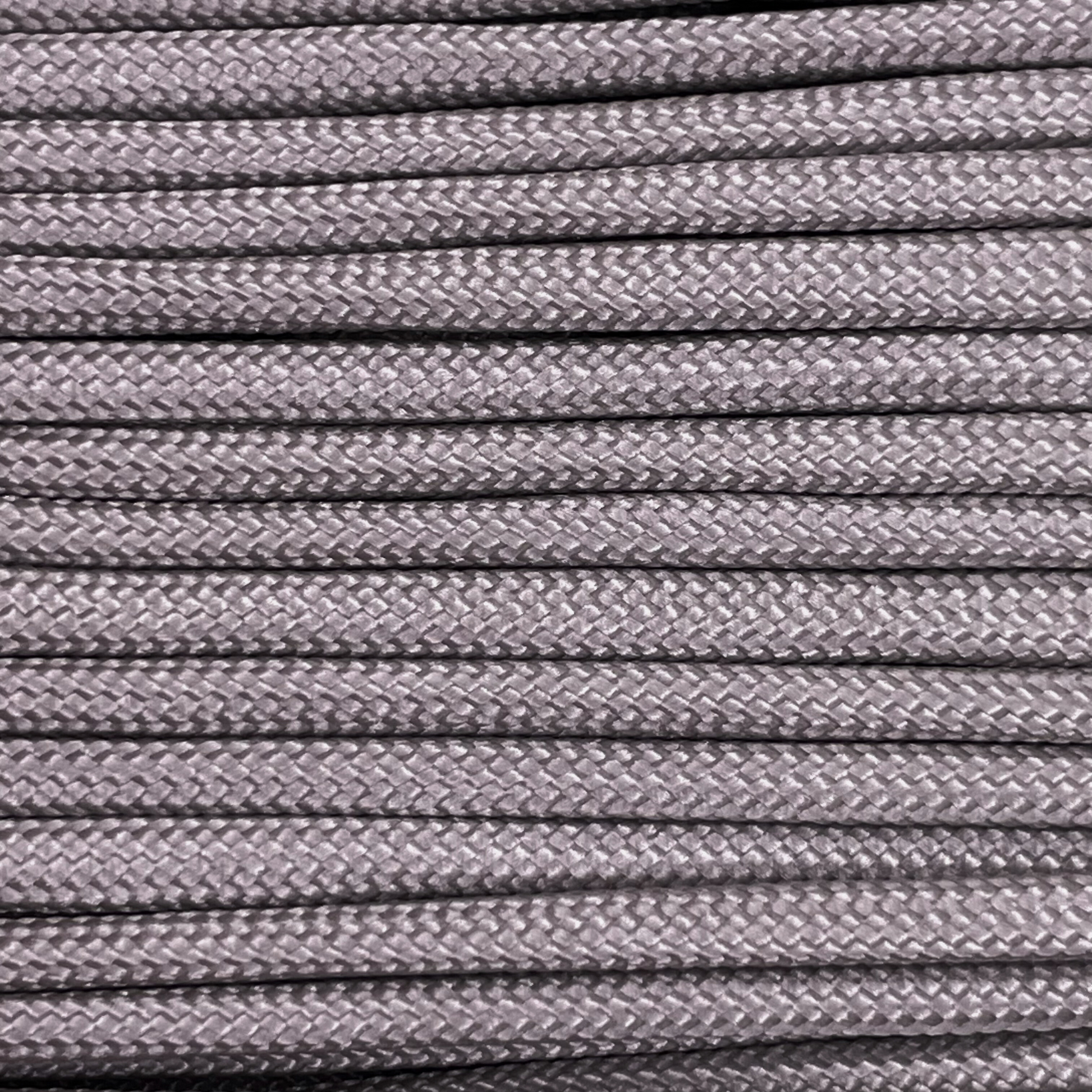 Close-up image of grey 550 paracord, showcasing the vibrant colour and texture of the material.