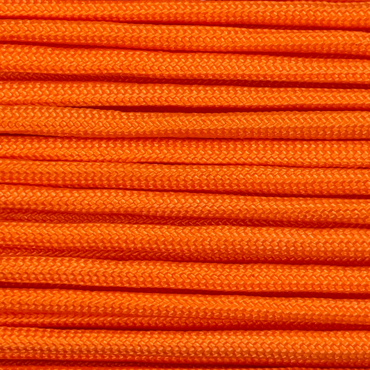 Close-up image of orange 550 paracord, showcasing the vibrant colour and texture of the material.