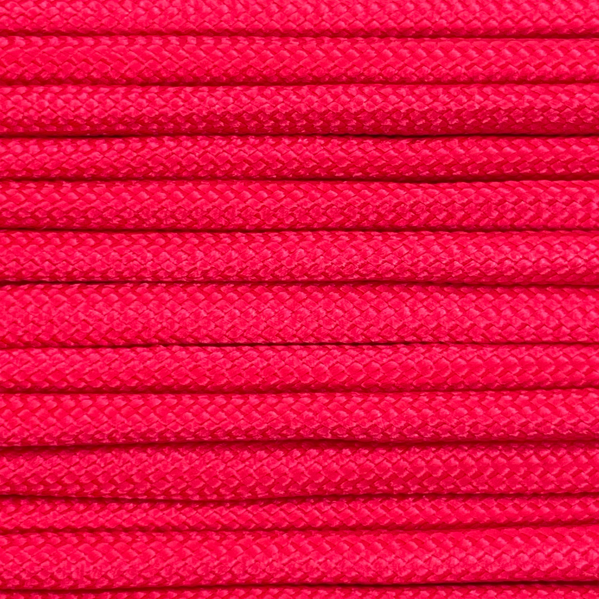 Close-up image of red 550 paracord, showcasing the vibrant colour and texture of the material.