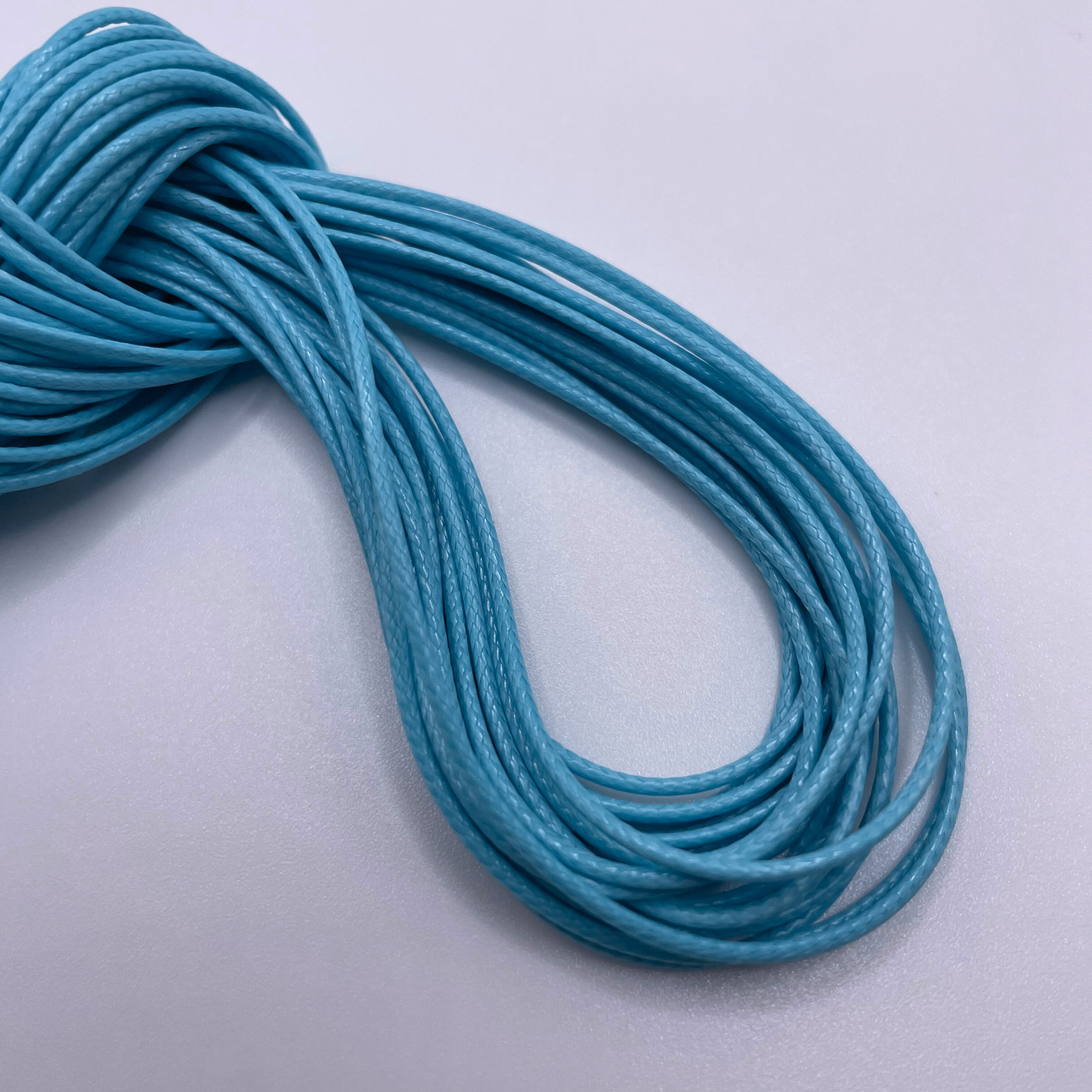 Close-up image of 1mm Waxed Cotton Cord, showcasing the vibrant colour and texture of the material.