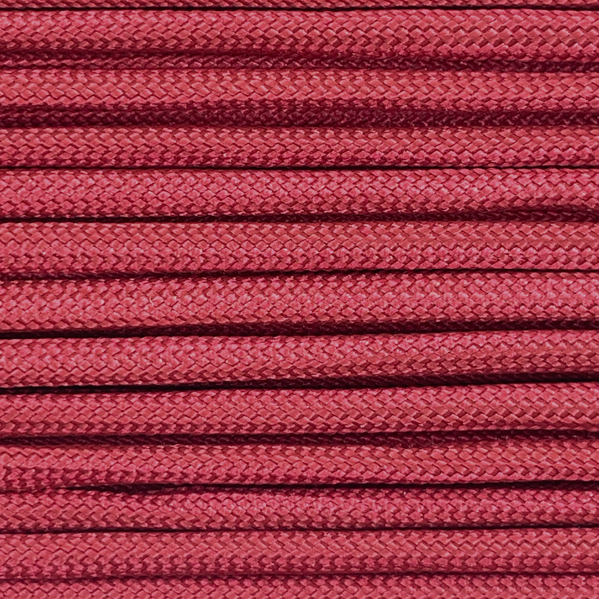 Close-up image of wine red 550 paracord, showcasing the vibrant colour and texture of the material.