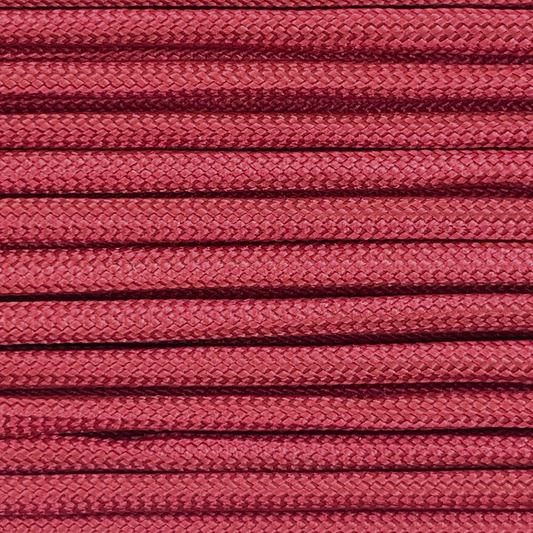 Close-up image of wine red 550 paracord, showcasing the vibrant colour and texture of the material.